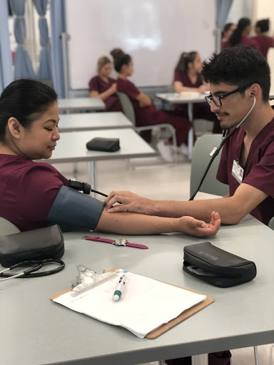 2 students taking Vital Signs